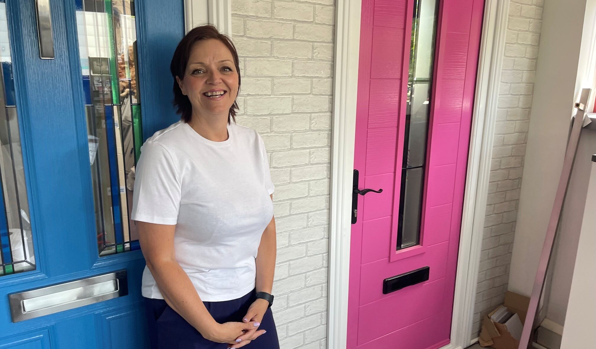 Jodie Jefferson, director, Didcot Windows standing in front of an Apeer door 2026